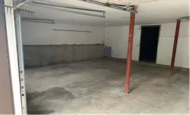 Basement cleared to the concrete floor, steel columns and bulkhead door open